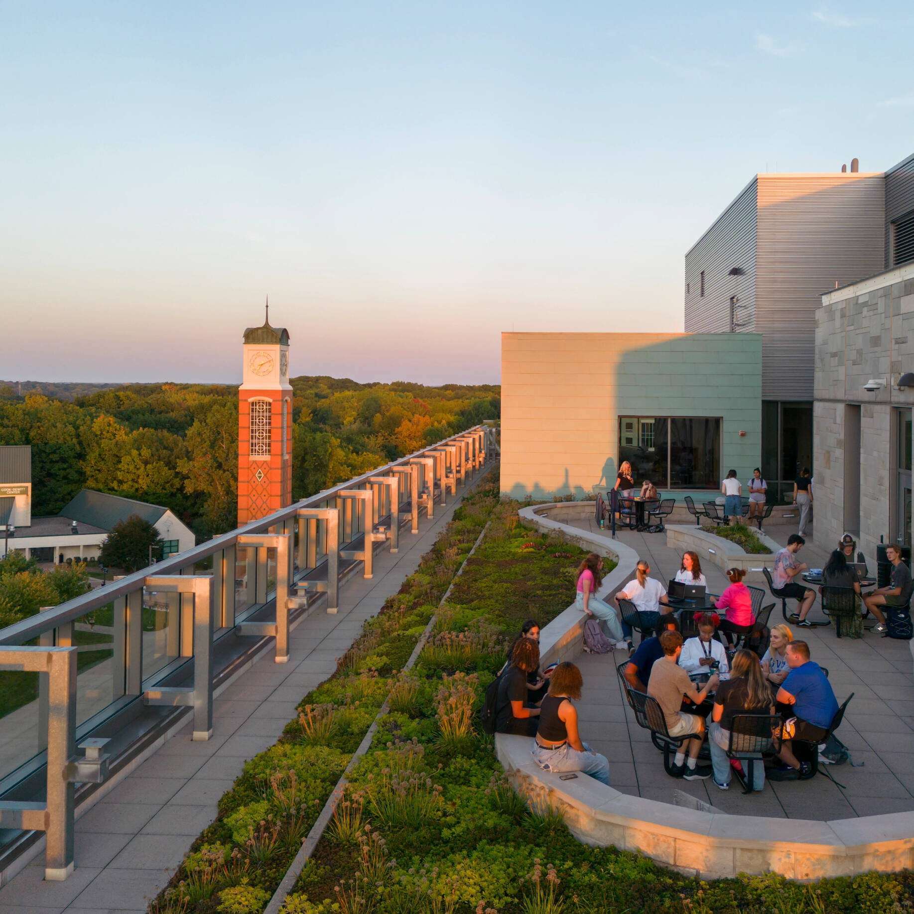 Students gathered on the Mary Idema Pew rooftop at sunset.